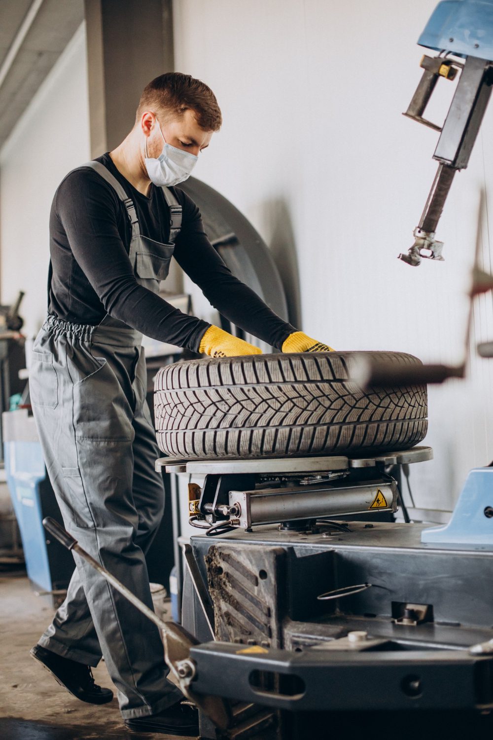 car-mechanic-changing-wheels-car-photo